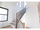 Modern staircase with light wood and black metal accents at 2133 N Talbott St, Indianapolis, IN 46202