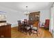 Elegant dining room features hardwood floors and a beautiful chandelier at 3531 Shoshonee Dr, Columbus, IN 47203