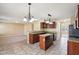 Eat-in kitchen featuring granite countertops and an island at 12618 Tealwood Dr, Indianapolis, IN 46236