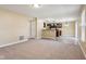 Open dining room with kitchen access and tile floor at 12618 Tealwood Dr, Indianapolis, IN 46236