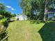 Large backyard with a shed and mature trees at 3106 Newton Ave, Indianapolis, IN 46201