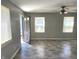 Living room with gray walls, wood-look floors, and ceiling fan at 3106 Newton Ave, Indianapolis, IN 46201