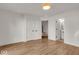 Bright bedroom with hardwood floors and access to bathroom at 671 E 16Th St, Indianapolis, IN 46202