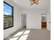 Bright bedroom with large window, walk-in closet, and en-suite bathroom at 671 E 16Th St, Indianapolis, IN 46202