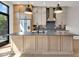 Large kitchen island with granite countertops and black faucet at 671 E 16Th St, Indianapolis, IN 46202