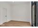 Bright home office features light walls, wood floors, and modern door at 671 E 16Th St, Indianapolis, IN 46202