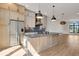 Modern kitchen with island, stainless steel appliances, and hardwood floors at 671 E 16Th St, Indianapolis, IN 46202