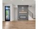 Modern gas fireplace with a gray shiplap wall at 671 E 16Th St, Indianapolis, IN 46202