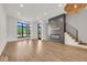 Bright living room with hardwood floors and large windows at 671 E 16Th St, Indianapolis, IN 46202