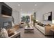 Open living area with fireplace, hardwood floors, and modern furniture at 671 E 16Th St, Indianapolis, IN 46202