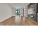 Spacious living room featuring hardwood floors and large windows at 671 E 16Th St, Indianapolis, IN 46202