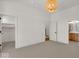 Spacious bedroom with carpeted floors, walk-in closet, and access to bathroom at 671 E 16Th St, Indianapolis, IN 46202