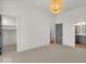 Bright bedroom with ample closet space and carpet flooring at 673 E 16Th St, Indianapolis, IN 46202