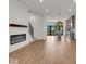 Open living room with fireplace and kitchen view at 673 E 16Th St, Indianapolis, IN 46202