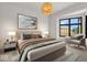 Spacious bedroom with large window and sitting area at 673 E 16Th St, Indianapolis, IN 46202