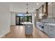 Modern kitchen with gray cabinets, quartz countertops, and stainless steel appliances at 673 E 16Th St, Indianapolis, IN 46202