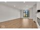 Light-filled living room with hardwood floors and a window view at 673 E 16Th St, Indianapolis, IN 46202