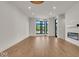 Spacious living room featuring hardwood floors and large windows at 673 E 16Th St, Indianapolis, IN 46202