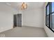 Spacious bedroom with large window and modern light fixture at 673 E 16Th St, Indianapolis, IN 46202