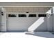 Attached garage with modern door and windows for light at 675 E 16Th St, Indianapolis, IN 46202