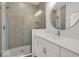 Modern bathroom with a large shower and round mirror at 675 E 16Th St, Indianapolis, IN 46202