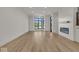 Spacious living room with hardwood floors and large windows at 675 E 16Th St, Indianapolis, IN 46202