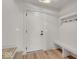 Bright entryway with built-in bench, hooks, and neutral tones at 675 E 16Th St, Indianapolis, IN 46202