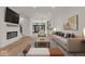 Open concept living room with modern furniture and a fireplace at 675 E 16Th St, Indianapolis, IN 46202