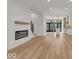 Bright and airy living room with hardwood floors and a fireplace at 675 E 16Th St, Indianapolis, IN 46202