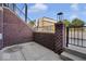 Private patio with brick wall and steps leading to the street at 675 E 16Th St, Indianapolis, IN 46202