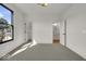 Well-lit bedroom with large window and an ensuite bathroom at 675 E 16Th St, Indianapolis, IN 46202