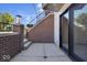Private patio with brick wall and access from sliding door at 675 E 16Th St, Indianapolis, IN 46202