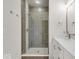 Modern bathroom with double vanity and a glass shower at 675 E 16Th St, Indianapolis, IN 46202