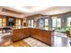 Modern kitchen with wood cabinetry, granite countertops, and an island at 4499 W 131St St, Carmel, IN 46074