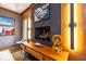 Modern fireplace with wood mantel and unique decor at 4499 W 131St St, Carmel, IN 46074