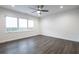 Bright bedroom with dark gray floors and ceiling fan at 810 7Th St, Columbus, IN 47201