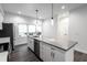 Modern kitchen with island and white cabinetry at 810 7Th St, Columbus, IN 47201