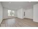 Bright and spacious living room with large windows and hardwood floors at 5715 Cr W 750 N, McCordsville, IN 46055