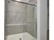 Modern shower with gray tile and sliding glass doors at 5715 Cr W 750 N, McCordsville, IN 46055