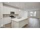 Modern kitchen with white cabinets, quartz countertops, and stainless steel appliances at 5715 Cr W 750 N, McCordsville, IN 46055