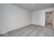 Well-lit bedroom featuring gray carpet and a door at 5715 Cr W 750 N, McCordsville, IN 46055