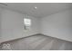 Bedroom with gray carpet, window, and closet at 5715 Cr W 750 N, McCordsville, IN 46055
