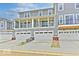 Rear view of townhomes showcasing attached garages and private balconies at 5715 Cr W 750 N, McCordsville, IN 46055