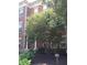 Brick townhouse exterior with landscaping and tree at 6343 Central Blvd, Whitestown, IN 46075