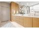 Modern bathroom with double vanity and a large mirror at 501 S East St, Indianapolis, IN 46225