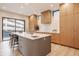Modern kitchen with a large island, wood cabinets, and quartz countertops at 501 S East St, Indianapolis, IN 46225
