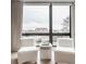 Relaxing sitting area with two comfy chairs and city view at 501 S East St, Indianapolis, IN 46225