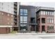 Modern three-story home with dark brick exterior and large windows at 501 S East St, Indianapolis, IN 46225