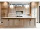 Modern kitchen with light wood cabinets and marble island at 505 S East St, Indianapolis, IN 46203