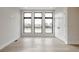 Spacious living room with hardwood floors and large windows at 505 S East St, Indianapolis, IN 46203
